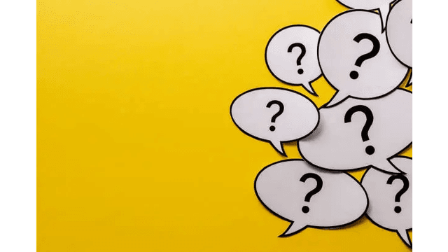 Several white speech bubbles with question marks on a yellow background.